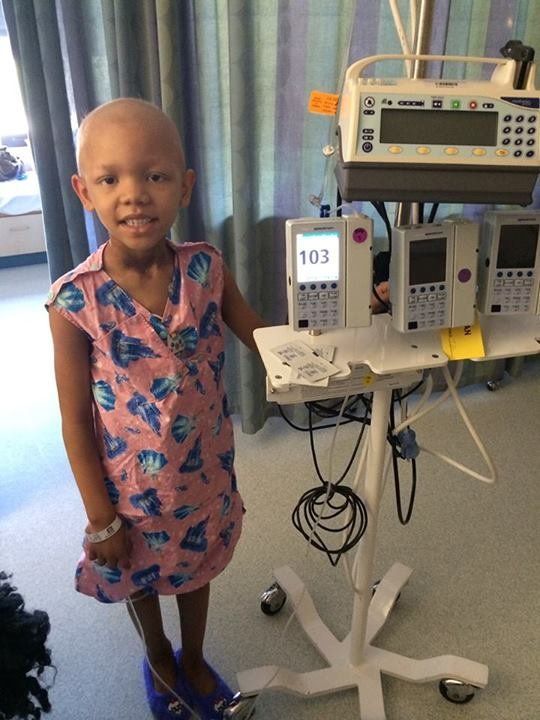 Tayliyah, diagnosed with Stage 3 Group 3 Rhabdomyosarcoma, wearing a Gracie's Gown in 2014.
