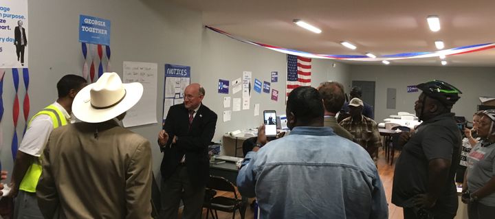 Georgia Democratic Party Chairman DuBose Porter gives volunteers a pep talk during a visit to the Macon-Bibb County Clinton-Kaine office in Macon last week.