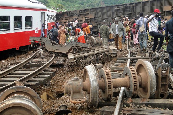 Passengers escape the site of the deadly train derailment in Eseka on Friday.