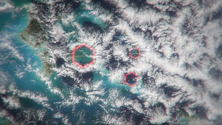 Hexagonal clouds marked on satellite imagery.