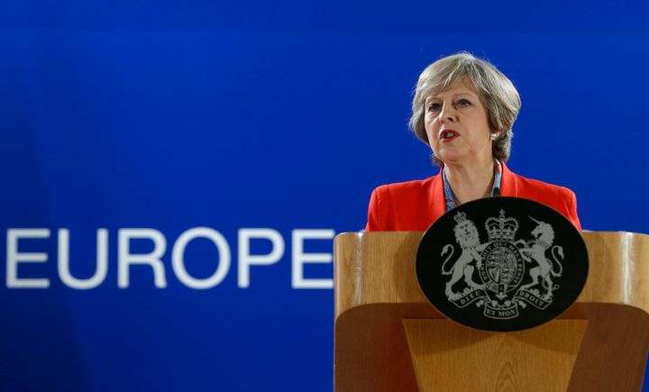 Britain's top banks are preparing to leave the UK as the Government's position on Brexit appears to be 'hardening'; Theresa May is pictured about at the EU Summit in Brussels on Friday
