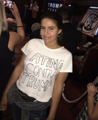 The Hillary Clinton supporter shows off her handmade T-shirt while attending a Trump rally in North Carolina on Friday.