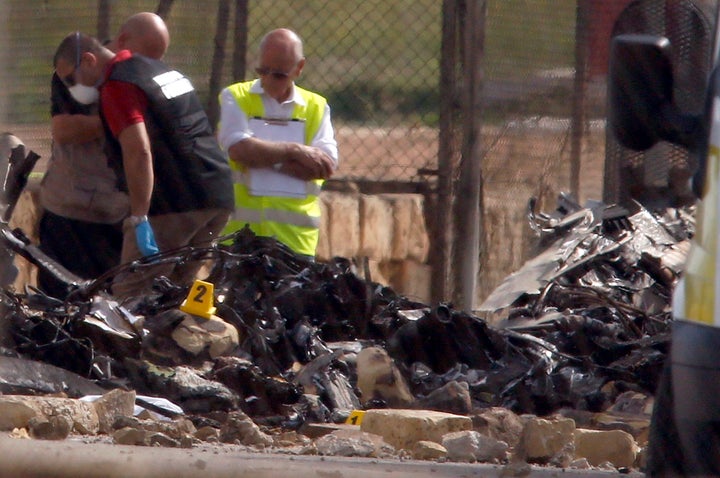 <strong>Investigators and rescue services at the scene of a plane crash at the airport on Monday</strong>
