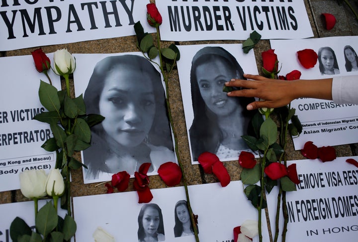 Tributes are left for Sumarti Ningsih, left, and Seneng Mujiasih, right 