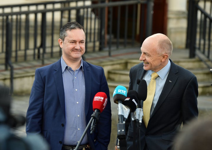 Gareth Lee (L) smiles following the verdict