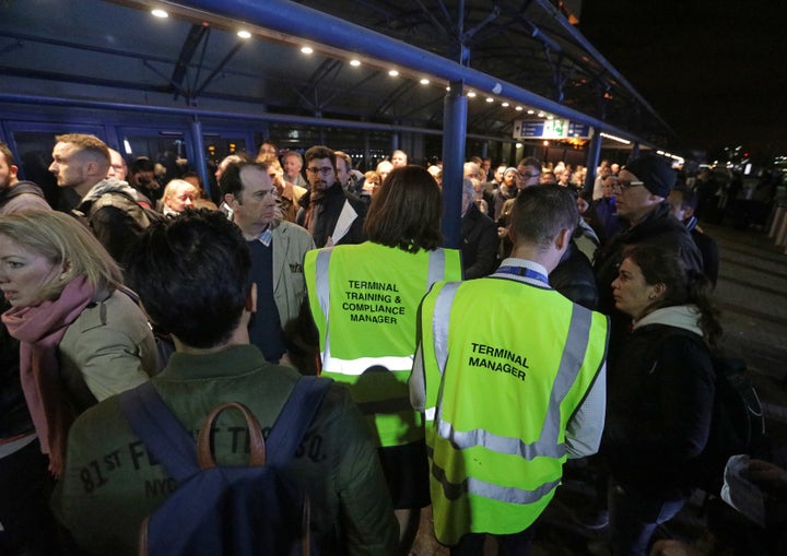 People queue London City Airport 