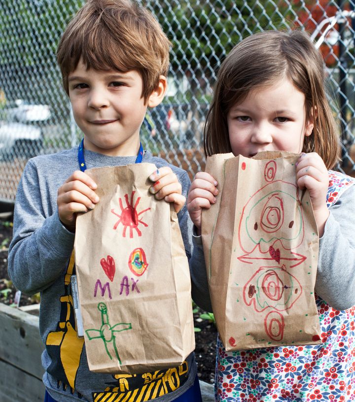 Max and Graecyn showing off their homelessness bags