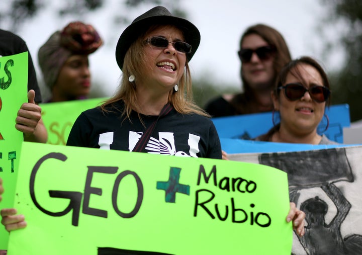 Protesters gathered in front of GEO Group headquarters in Boca Raton, Florida. The company made $150,000 in donations to super PACs supporting the presidential and Senate campaigns of Sen. Marco Rubio (R-Fla.).