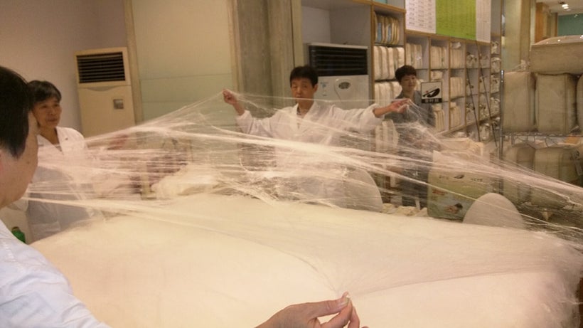 Quilt makers stretch each skein forming layers