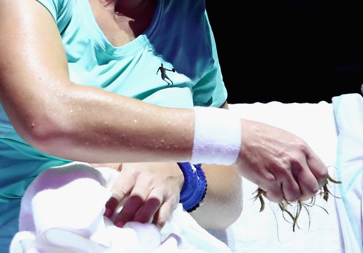 <strong>Svetlana Kuznetsova holds a handful of her hair</strong>
