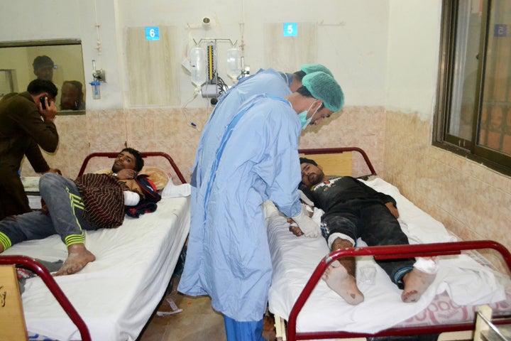 Medical workers treat an injured policeman at hospital after militants attacked the Balochistan Police College in Quetta on T