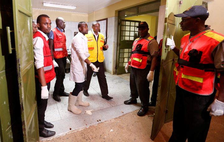 Mortuary attendants and Kenya Red Cross staff prepare to handle the bodies of civilians killed following an attack at the Bisharo lodging.