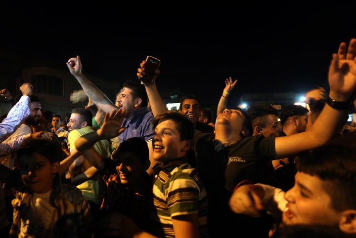 Displaced Iraqi Christians take part in celebrations on Oct. 18 in Erbil, the capital of Iraq's semi-autonomous Kurdish region, after Iraqi forces drove out ISIS from the largely Christian town of Qaraqosh. 