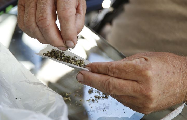A marijuana vendor prepares samples for enthusiasts gathered at the "Weed the People" event to celebrate the legalization of the recreational use of marijuana in Portland, Oregon July 3, 2015.
