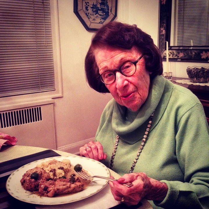 Grandma Belle samples a meal cooked for her by the author.