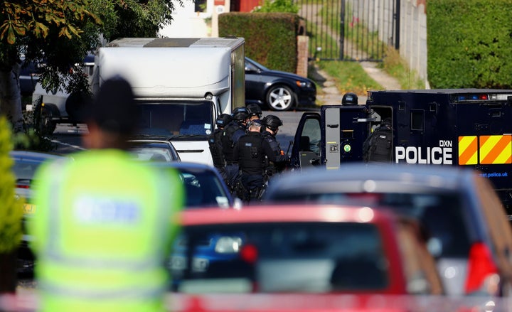 <strong>Armed police officers at the scene in Northolt, London.</strong>