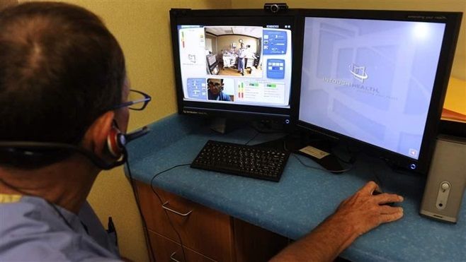 A neonatologist uses video equipment to consult with a doctor in rural Colorado. Amid a shortage of mental health providers, states are increasingly turning to telemedicine to meet the urgent need for drug addiction treatment and other behavioral health counseling.