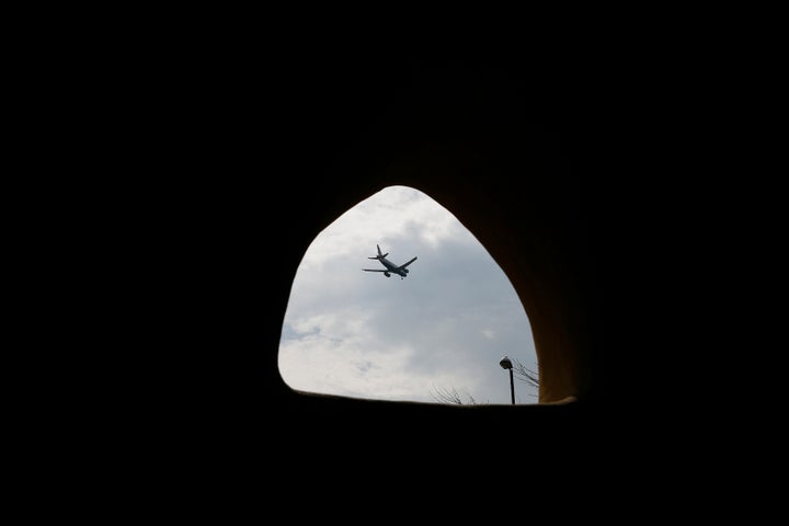 <strong>A plane passes overhead at Hounslow Heath infants school</strong>