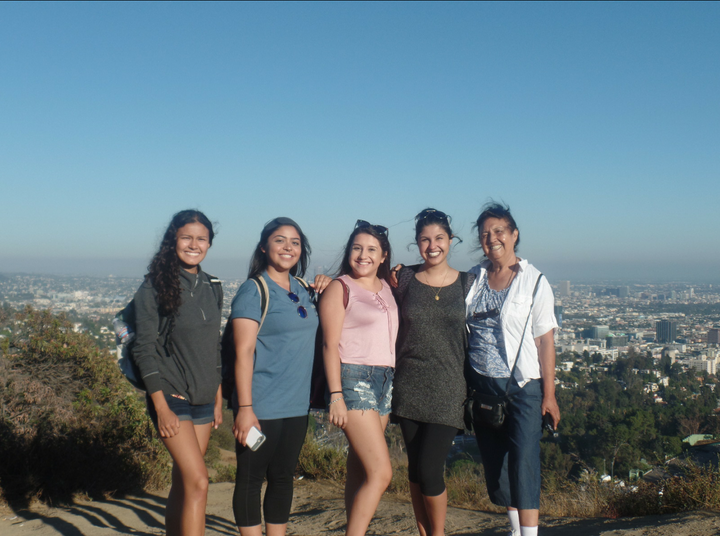 Ruiz, left, with her cousins and grandmother, right, at a spot overlooking Los Angeles. 