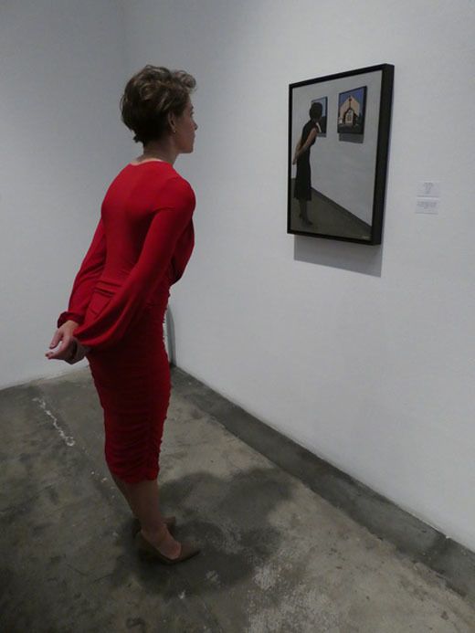 Jane Allen admiring On Closer Examination (a work featuring herself in last year's exhibition)