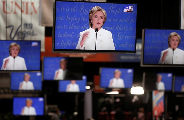 Democratic U.S presidential nominee Hillary Clinton is shown on TV monitors in the media filing room on the campus of University of Nevada, Las Vegas, during the last 2016 U.S. presidential debate in Las Vegas, U.S., October 19, 2016.