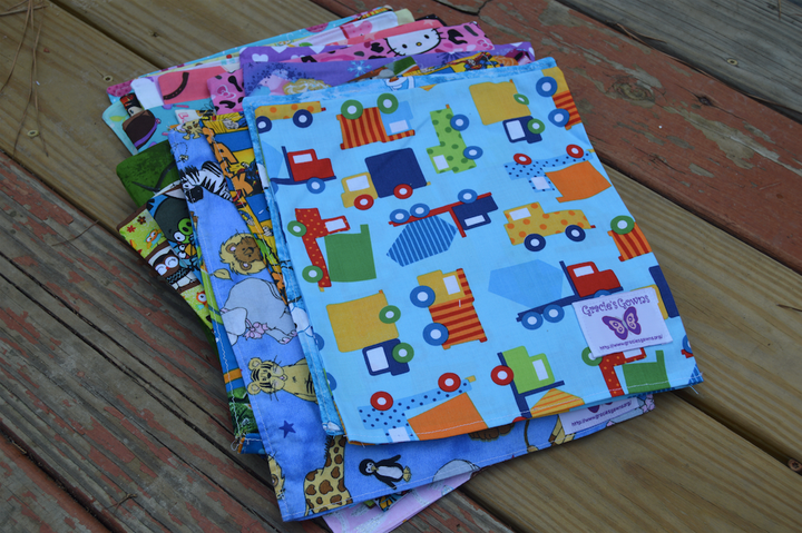 Kidd repurposes scraps from the child-sized gowns to make chemo bags, like these.