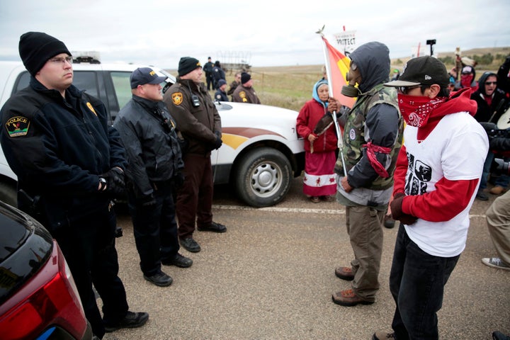 Dakota Access Pipeline protesters square off against police between the Standing Rock Reservation and the pipeline route outside the town of Saint Anthony, North Dakota, on Oct. 5, 2016.