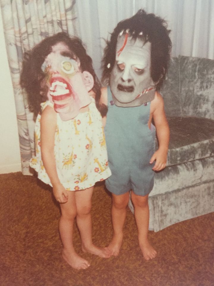 Katie and Jack wearing PapaBear’s Halloween masks. 