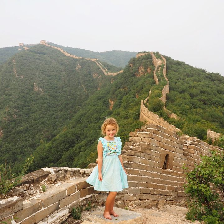 Emmie at the top of the Great Wall of China