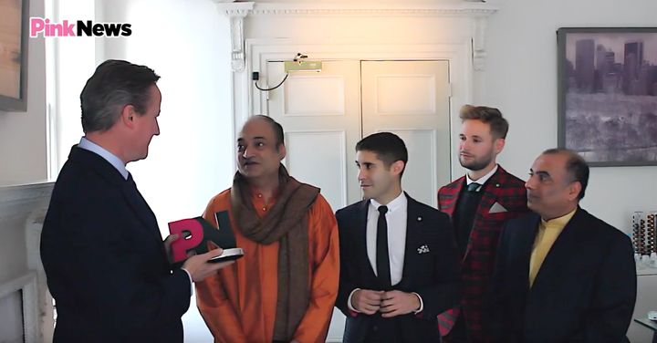 Cameron receiving his 'ally of the year' award from PinkNews executive Benjamin Cohen (second left) with his fiance Dr Antony James (third left) and Subodh Rathod and Niranjan Kamatkar