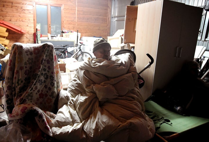 A person rests in a secured area after earthquakes hit the village of Visso, central Italy on Wednesday.