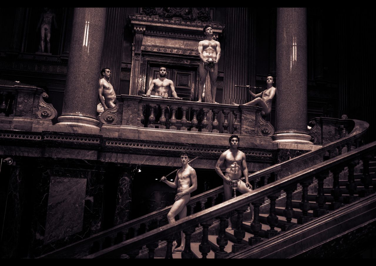 The hockey team hide their modesty on a historic staircase