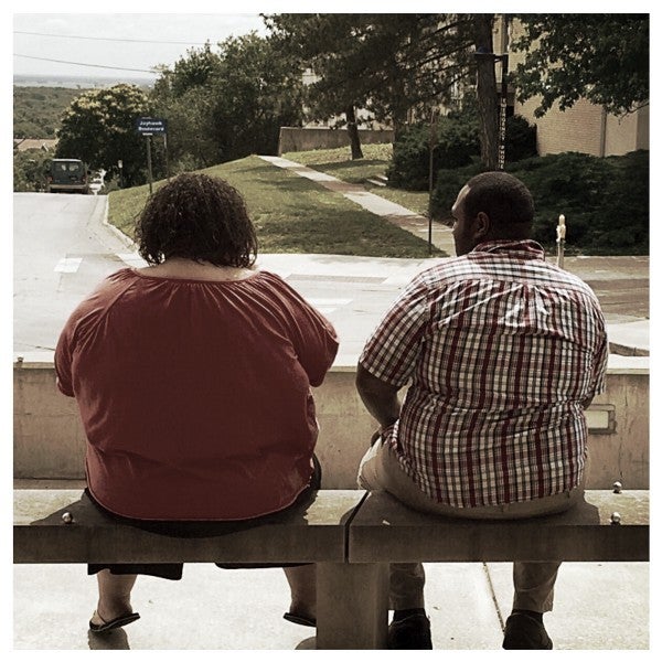 Two besties sitting on a bench contemplating life.