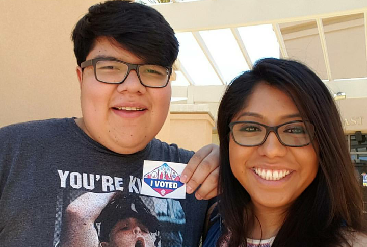 Alejandro Castro poses with his "I voted" sticker on the day of the 2016 Nevada primary, joined by his sister, Erika Castro.