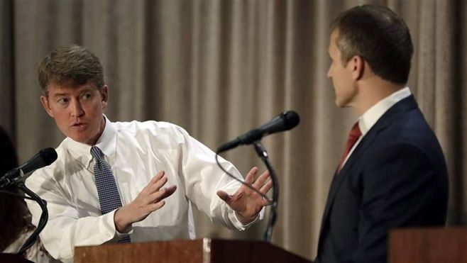 Missouri Democratic gubernatorial candidate Chris Koster, left, speaks to Republican candidate Eric Greitens during their first debate. A second debate was rejected over a dispute about tax returns and financial disclosure. 
