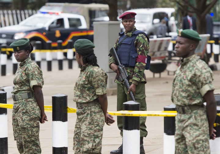 Kenyan security forces stand outside the Memorial Park in Nairobi on July 25, 2015.