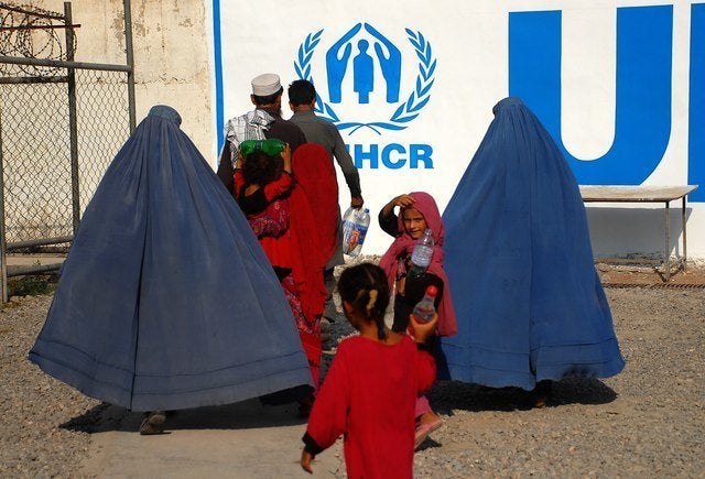 Afghan refugee families living in Pakistan arrive at the UNHCR’s repatriation center in Peshawar, before returning to Afghanistan.