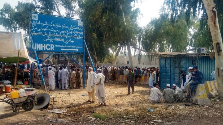 Long queues of Afghan refugees stretch out near the UNHCR repatriation center outside the Pakistani city of Peshawar.