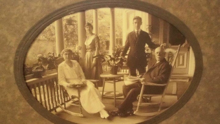 Mrs. Ursula Best, Emma Best, Dr. Duncan Best, and Dr. Christopher Best sit for a photo at their home, which was built in 1884