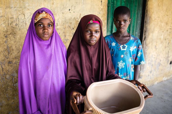 Zulyatu (center), 16, and her younger siblings rarely have enough to eat. Their father died during a Boko Haram raid and their mother left to seek health care from a healer.