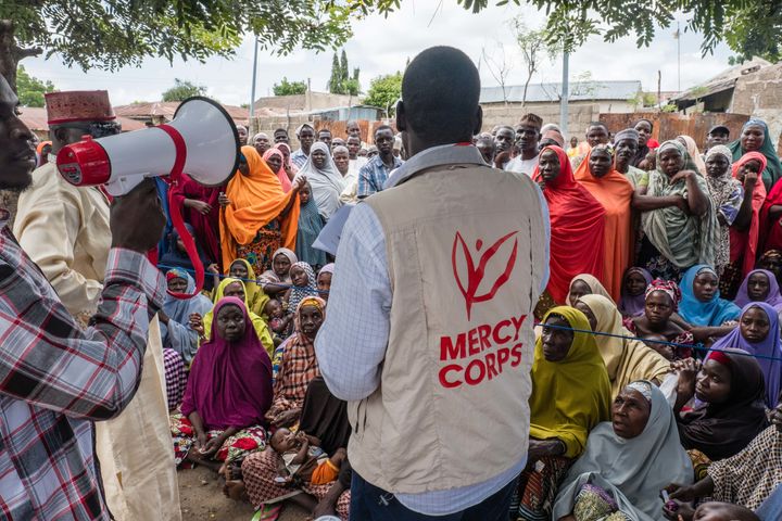Mercy Corps distributes e-vouchers for food for the first time ever to internally displaced people in a neighborhood in Biu, Nigeria.
