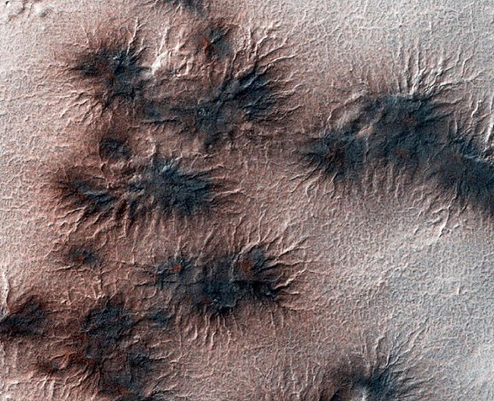 These spider-like surface features -- called araneiform terrain -- are on Mars’ south polar region. Scientists believe the naturally-forming cracks result from the spring season as warm temperatures thaw subsurface CO2 ice.