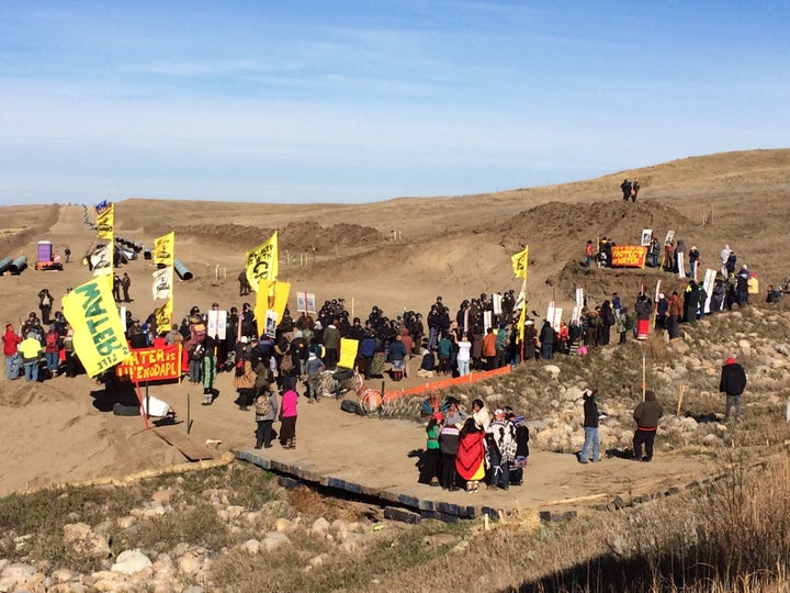 Protesters gather in Standing Rock, ND, at trench to protest the construction of the Dakota Access Pipeline.