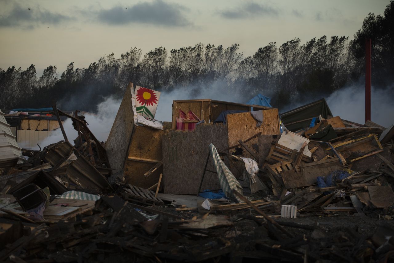 Tents destroyed are seen in the makeshift migrant camp known as the 'jungle' near Calais, northern France.