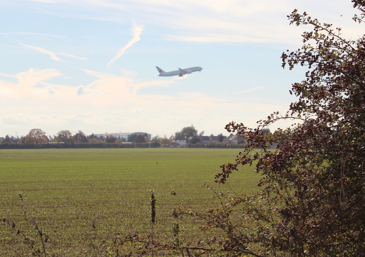 A plane ascends from the current northern runway at Heathrow over the village of Longford, near Harmondsworth