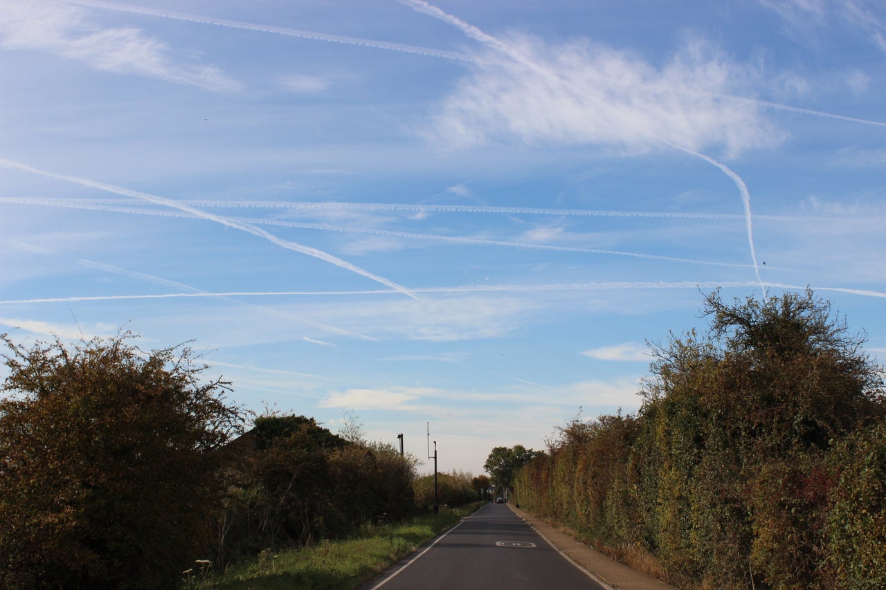 Vapour trails cloud the sky above the Heathrow villages, where a new runway is planned