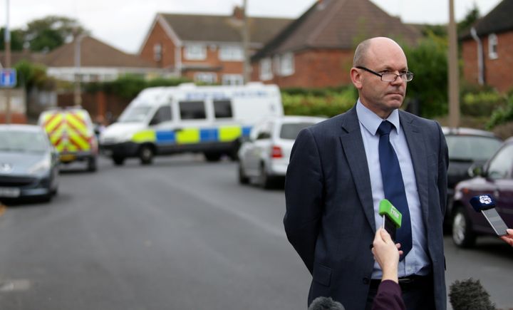 <strong>Detective chief inspector Matin Slevin speaks to media outside the property; police have revealed the children's father was found in a car fire some 40 miles away from the original blaze </strong>