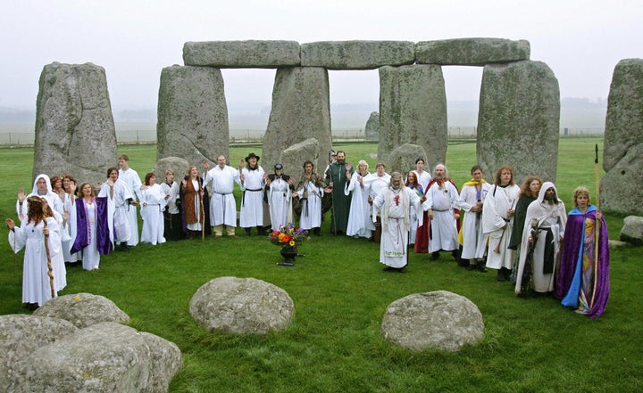 A file picture taken on October 17, 2006 shows druids performing a pagan Samhain blessing ceremony at Stonehenge, in Avebury, Wiltshire, in southern England.