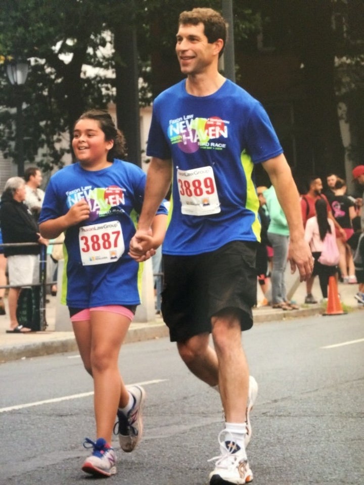 Josiah and his 11-year-old daughter at the finish line of a recent road race