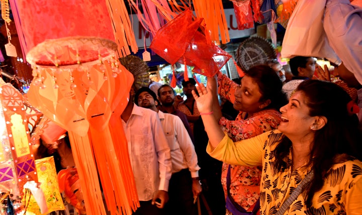 People buying Kandil (a colorful wall hanging specially used in Diwali) at a market near Crawford market on October 27, 2016 in Mumbai, India.